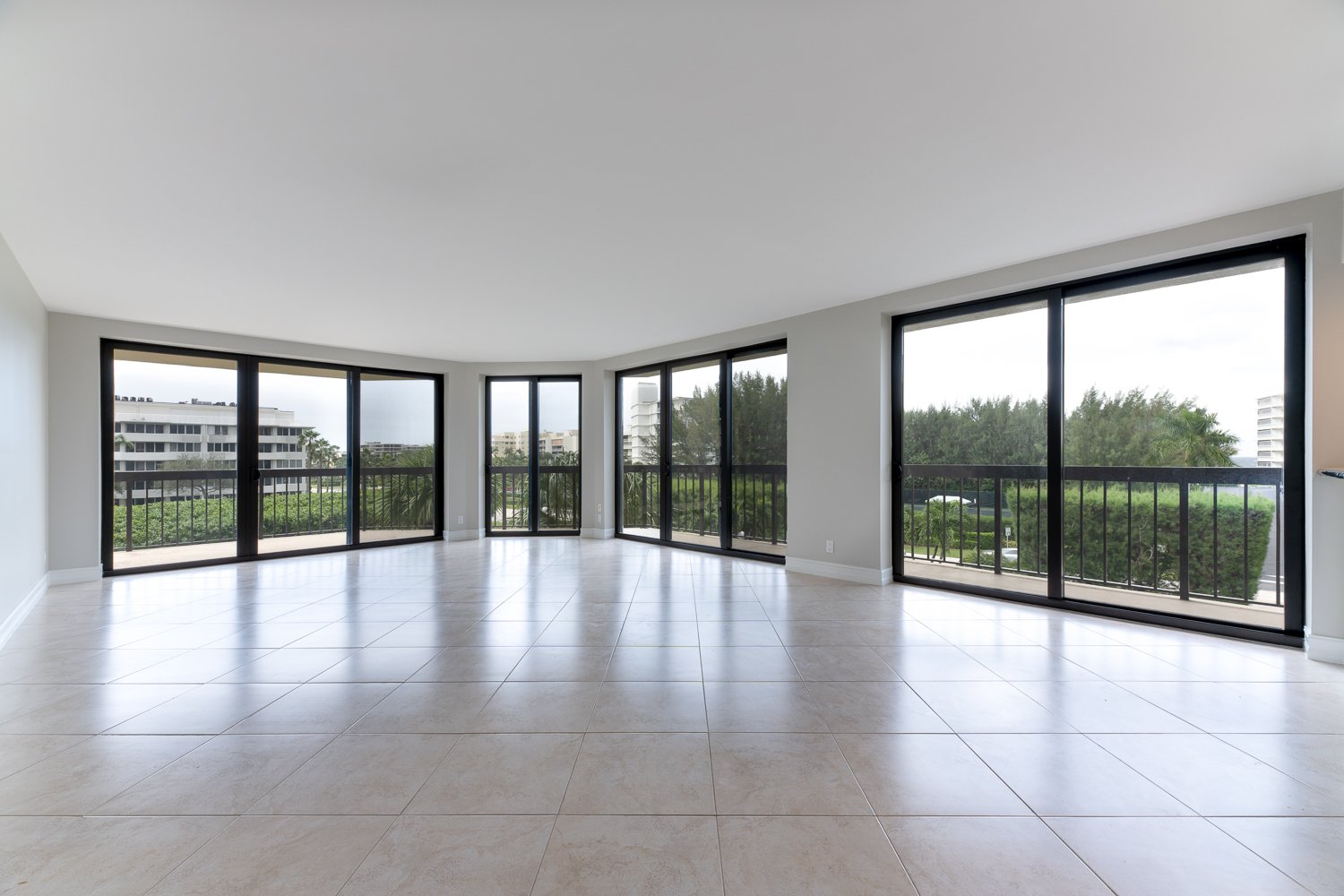 Window-lined living room, empty