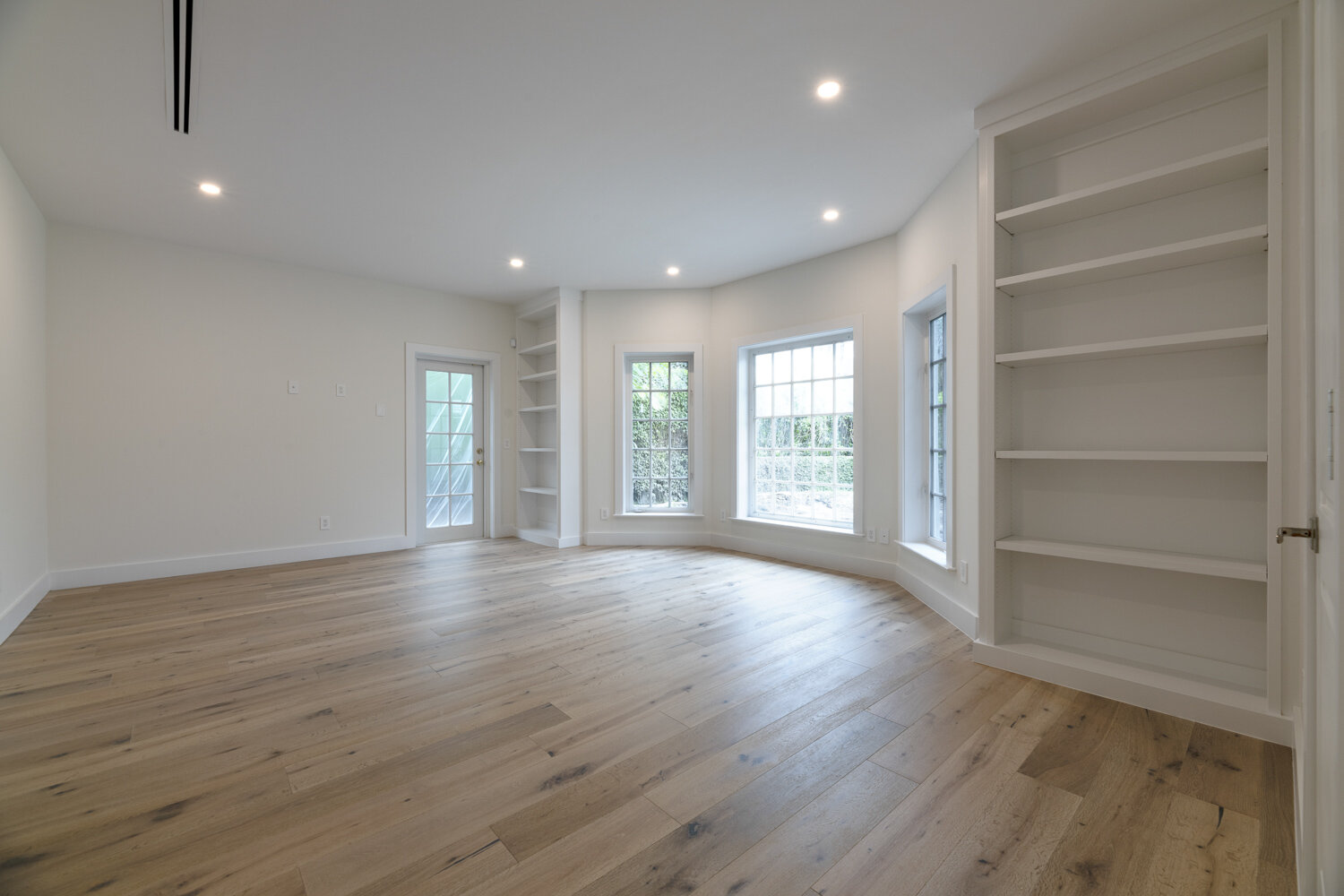 Room with built-in shelves, empty